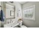 Modern half bathroom with stylish fixtures, bright lighting, and a clean, fresh design at 215 Arizona Ne Ave # 3, Atlanta, GA 30307