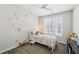 A bright bedroom with a floral accent wall, carpet, and window with blinds at 215 Arizona Ne Ave # 3, Atlanta, GA 30307