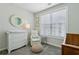 A delightful Bedroom with soft lighting, a cozy chair, and calming decor at 215 Arizona Ne Ave # 3, Atlanta, GA 30307