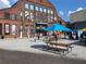 Outdoor community space with picnic tables and shade umbrellas at 215 Arizona Ne Ave # 3, Atlanta, GA 30307