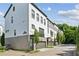 Modern townhome complex with brick facade and well-manicured landscaping at 215 Arizona Ne Ave # 3, Atlanta, GA 30307