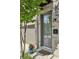 A close-up of a townhome's front door, framed by brick and neat landscaping at 215 Arizona Ne Ave # 3, Atlanta, GA 30307
