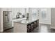 Bright kitchen with white cabinets, stainless appliances, and a large island at 215 Arizona Ne Ave # 3, Atlanta, GA 30307