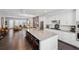Open kitchen with white cabinets, stainless appliances, island seating and hardwood floors at 215 Arizona Ne Ave # 3, Atlanta, GA 30307