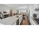 Open concept view of the kitchen with an island, stainless appliances and wood floors at 215 Arizona Ne Ave # 3, Atlanta, GA 30307