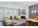 Inviting living room showcases a cozy fireplace and seamless flow to the dining area at 215 Arizona Ne Ave # 3, Atlanta, GA 30307
