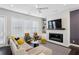Bright living room with a fireplace, large windows, and comfortable seating for relaxation at 215 Arizona Ne Ave # 3, Atlanta, GA 30307
