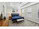 Spacious main bedroom with modern tray ceilings, recessed lighting, and an abundance of natural light at 215 Arizona Ne Ave # 3, Atlanta, GA 30307