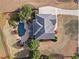 Stunning aerial view of a home with a private pool, lush landscaping, and a spacious driveway at 410 Hickory Fairway Ct, Woodstock, GA 30188