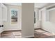 Bright bedroom featuring hardwood floors, two windows, and ample closet space for storage at 410 Hickory Fairway Ct, Woodstock, GA 30188