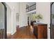 Elegant foyer with hardwood floors, high ceilings, and staircase access at 410 Hickory Fairway Ct, Woodstock, GA 30188