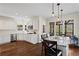 Updated kitchen has stainless appliances, gas cooktop, island with bar seating, and access to the patio at 410 Hickory Fairway Ct, Woodstock, GA 30188
