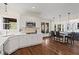 Spacious kitchen with stainless steel appliances, island with seating, and hardwood floors at 410 Hickory Fairway Ct, Woodstock, GA 30188