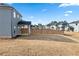 Large, grassy backyard with wood fence and covered patio, perfect for outdoor entertaining at 4798 Red Lion Pl, Lawrenceville, GA 30044