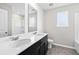 Bright bathroom with dual sinks, modern finishes, and tile flooring at 4798 Red Lion Pl, Lawrenceville, GA 30044