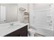 Well-lit bathroom featuring a tub/shower combo and a modern vanity with storage at 4798 Red Lion Pl, Lawrenceville, GA 30044