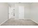 A bedroom with carpeted floor, white trim, and natural light at 4798 Red Lion Pl, Lawrenceville, GA 30044