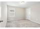 Cozy bedroom with neutral carpet and a window offering natural light at 4798 Red Lion Pl, Lawrenceville, GA 30044