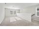 Upstairs bonus room with neutral carpet, lots of natural light and staircase at 4798 Red Lion Pl, Lawrenceville, GA 30044