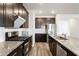 Well-equipped kitchen featuring a large island, granite countertops, and modern appliances at 4798 Red Lion Pl, Lawrenceville, GA 30044