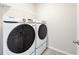 Laundry room featuring a modern washer and dryer at 4798 Red Lion Pl, Lawrenceville, GA 30044