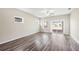 Bright living room with sliding glass doors leading to an outdoor patio, wood-look flooring at 4798 Red Lion Pl, Lawrenceville, GA 30044