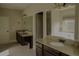 Bathroom featuring double sink vanity with granite countertops and a large mirror at 505 Mirror Lake Pkwy, Villa Rica, GA 30180