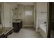 Elegant bathroom with granite counters, double sinks, and a luxurious soaking tub at 505 Mirror Lake Pkwy, Villa Rica, GA 30180