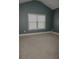 Large bedroom featuring a window and carpeted floors at 505 Mirror Lake Pkwy, Villa Rica, GA 30180