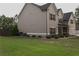 Well-maintained home showcasing a tidy lawn and mature trees at 505 Mirror Lake Pkwy, Villa Rica, GA 30180