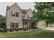 Inviting two-story home featuring classic architecture, landscaping, and a spacious front lawn at 505 Mirror Lake Pkwy, Villa Rica, GA 30180