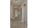 Hallway with carpet and several doors leading to other rooms at 505 Mirror Lake Pkwy, Villa Rica, GA 30180