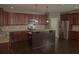 Well-equipped kitchen boasting stainless steel appliances, granite countertops, and a central island at 505 Mirror Lake Pkwy, Villa Rica, GA 30180