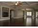 Expansive living room featuring a stone fireplace, hardwood floors, and coffered ceilings at 505 Mirror Lake Pkwy, Villa Rica, GA 30180