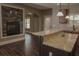 Inviting living room boasts a stone fireplace, hardwood floors and an open floor plan, great for entertaining at 505 Mirror Lake Pkwy, Villa Rica, GA 30180