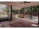 Covered porch with ceiling fan and view of large fenced backyard at 505 Mirror Lake Pkwy, Villa Rica, GA 30180