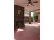Spacious covered porch features an outdoor fireplace and wooded views at 505 Mirror Lake Pkwy, Villa Rica, GA 30180