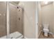 Updated bathroom with walk-in shower and matching toilet at 559 Myrle Trace Ln, Suwanee, GA 30024
