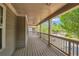 A beautiful covered porch with classic railings, wooden flooring, and neighborhood views at 559 Myrle Trace Ln, Suwanee, GA 30024