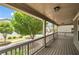 View of the neighborhood from a covered porch featuring wooden flooring and railings at 559 Myrle Trace Ln, Suwanee, GA 30024
