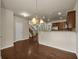 Open concept dining area adjacent to kitchen and staircase boasts hardwood floors at 559 Myrle Trace Ln, Suwanee, GA 30024