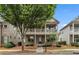Charming two-story home with a front porch and balcony overlooking a well-maintained, beautifully landscaped front yard at 559 Myrle Trace Ln, Suwanee, GA 30024