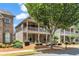 Beautiful two-story home boasting a cozy porch and balcony that enhances its curb appeal, surrounded by lush landscaping at 559 Myrle Trace Ln, Suwanee, GA 30024