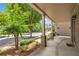 Cozy covered front porch with brick pillars and a concrete floor, creating an inviting outdoor space to enjoy the surroundings at 559 Myrle Trace Ln, Suwanee, GA 30024