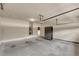 Spacious garage with plenty of room for storage and parking, plus epoxy floor at 559 Myrle Trace Ln, Suwanee, GA 30024