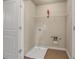 Functional laundry room featuring a utility sink and wire shelving for storage at 559 Myrle Trace Ln, Suwanee, GA 30024