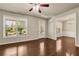 Bright living room featuring hardwood floors, large windows and view to the dining room at 559 Myrle Trace Ln, Suwanee, GA 30024