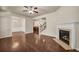 Open floor plan with hardwood floors, fireplace and views into the dining and kitchen areas at 559 Myrle Trace Ln, Suwanee, GA 30024