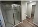 Modern bathroom features frameless glass shower, tile floors, and walk-in closet at 108 Deer Xing, Temple, GA 30179
