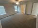 Spacious bedroom featuring carpeted floors, ceiling fan, and ensuite bathroom at 108 Deer Xing, Temple, GA 30179